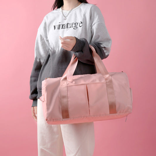 Large capacity waterproof travel duffel bag made from durable Oxford cloth for weekend trips and gym use.