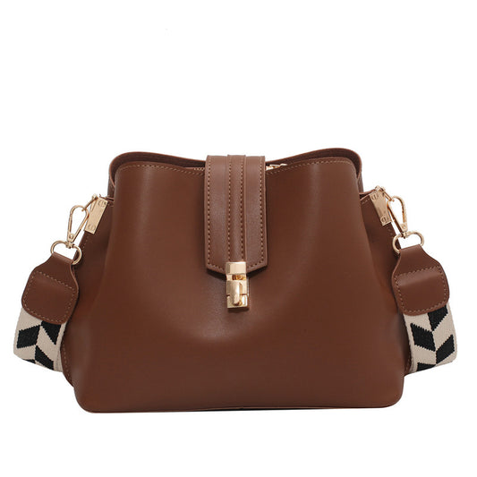 Stylish women's medium bucket shoulder bag made from soft PU leather with a comfortable wide strap for everyday use.