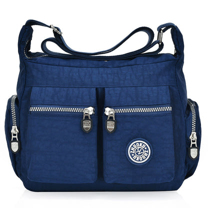 Durable nylon shoulder handbag offering lightweight comfort and everyday functionality.