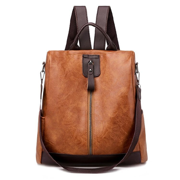 Soft leather urban backpack featuring a secure anti-theft compartment for carrying daily essentials comfortably.
