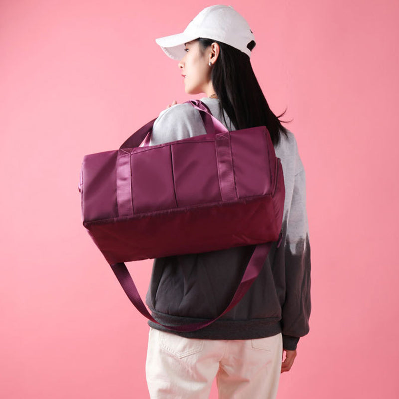 Waterproof sports duffel bag featuring an adjustable shoulder strap and comfortable carry handles.
