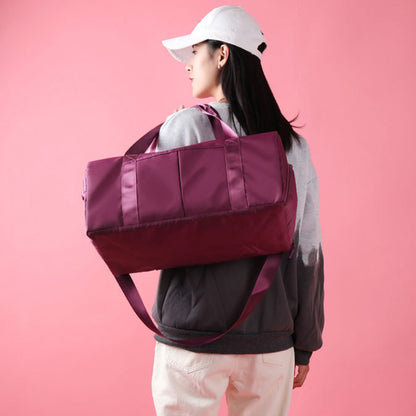 Waterproof sports duffel bag featuring an adjustable shoulder strap and comfortable carry handles.