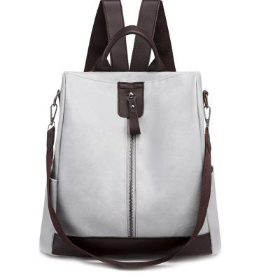 Women's anti-theft soft leather backpack available in black, green, brown, and white for stylish everyday wear.