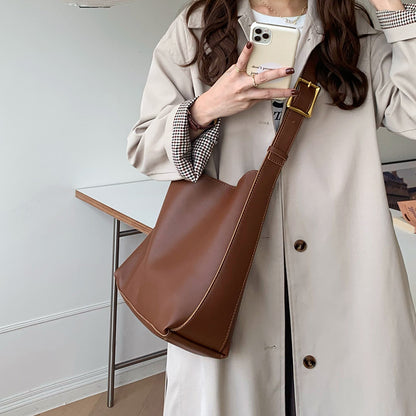 Lightweight women's PU leather shoulder purse perfect for work, shopping, and daily essentials.