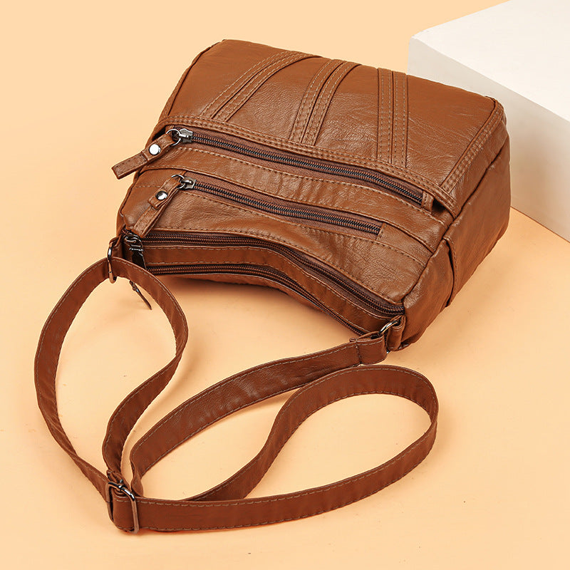 Inside pocket view of soft PU crossbody bag for easy organization