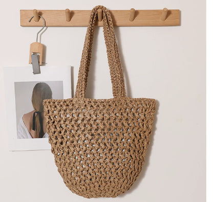 Free inner pocket included with handwoven raffia tote bag