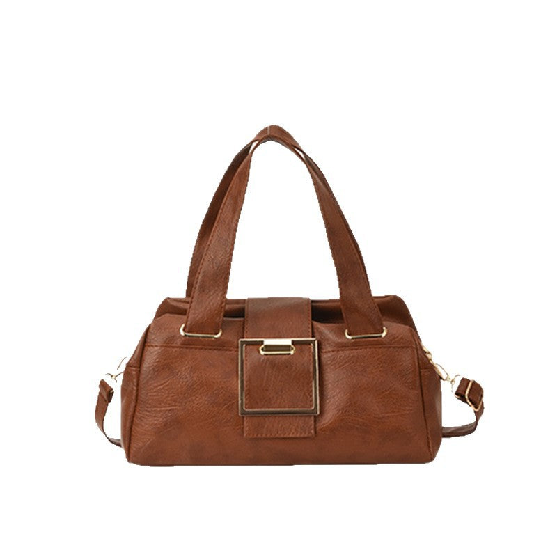 Side profile of structured horizontal square PU leather handbag