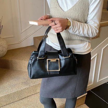 Retro buckle leather handbag available in black, brown, and wine red