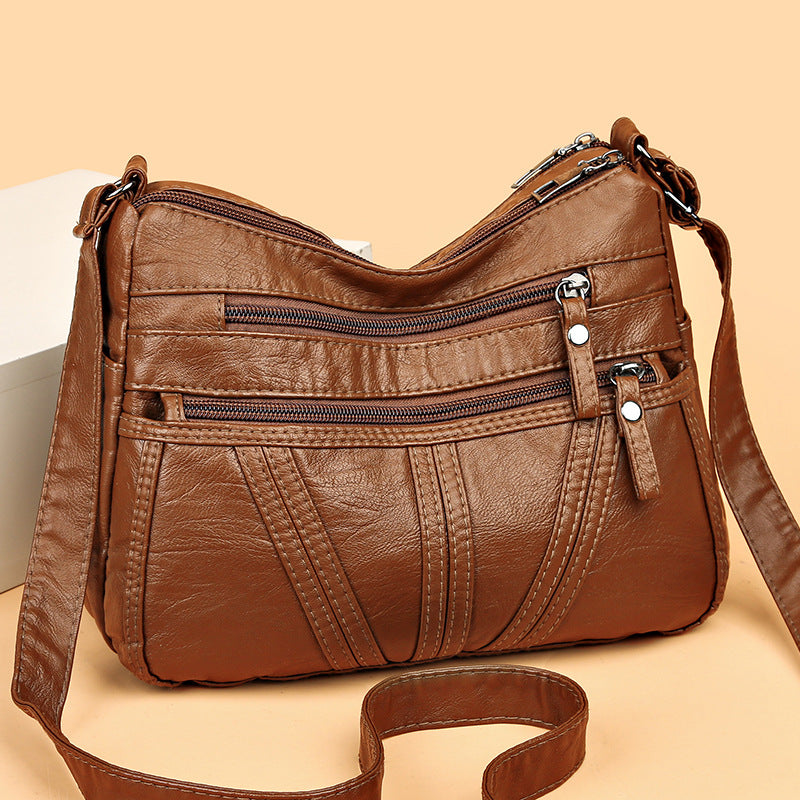 Close-up of soft washed-leather texture on PU crossbody bag